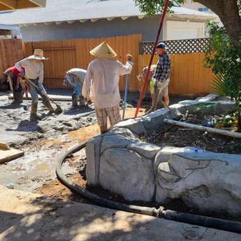 Hana Pools - Guys hard at work pouring concrete - Masonry/Concrete Near Me