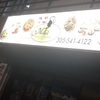 Millys Restaurant - They have a like a secret side entrance right under this sign just took for it lol - Latin American Near Me - Miami, Florida Millys Restaurant - They have a like a secret side entrance right under this sign just took for it lol - Latin American Near Me - Miami, Florida