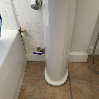 Jotaye Group - This is what the wall looked like before the repair. You can see the rot on the left close to the bathtub. - Home Cleaning Near Me - Hollywood, Florida Jotaye Group - This is what the wall looked like before the repair. You can see the rot on the left close to the bathtub. - Home Cleaning Near Me - Hollywood, Florida