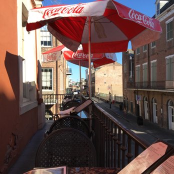 Chartres House - View from my table-bent and broken umbrella on table ahead of mine. - Beer Bar Near Me - New Orleans, Louisiana