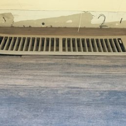 Baseboard was up to me, but this vent is apparently "properly installed" after completion of the floor.