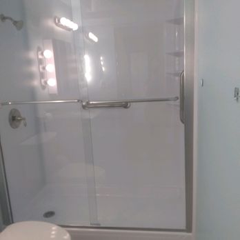Bath Fitter - a white toilet and shower - General Contractors Near Me - Spokane Valley, Washington