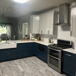 Timeline Roofing and Remodeling - After: microwave removed from top of stove and custom built into cabinet and added a new range at top of stove