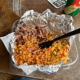 a plate of food with meat and rice a plate of food with meat and rice
