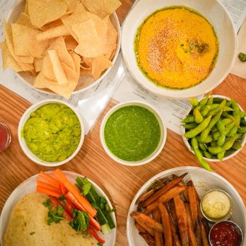 CALI - Tampa Palms - Turmeric Hummus - DF PB, Hand cut Herb Fries - GF DF PB, edamame, guacamole, Chips & Tomatillo Salsa - GF DF PB - New American Near Me - Tampa, Florida CALI - Tampa Palms - Turmeric Hummus - DF PB, Hand cut Herb Fries - GF DF PB, edamame, guacamole, Chips & Tomatillo Salsa - GF DF PB - New American Near Me - Tampa, Florida
