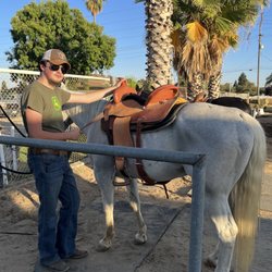 Rising Sun Horseback Riding - Learning about saddling