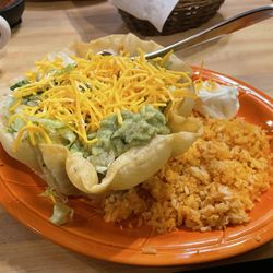 El Torero - Tostada Grande with an order of extra chicken in the bowl