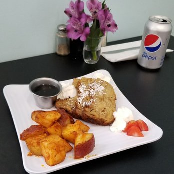Jester's Café - French Toast Casserole with Home Fries and a side of Maple Syrup - New American Near Me - Wilmington, North Carolina Jester's Café - French Toast Casserole with Home Fries and a side of Maple Syrup - New American Near Me - Wilmington, North Carolina