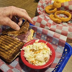 Grumpy's Diner - Reuben sandwich with slaw and onion rings. Mmmmm Mmmm Mmmmm!
