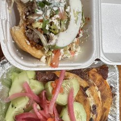 Taqueria La Marianita - A gordita topped with "Campechana" meat, aka Pastor (pork style) & fajita, lettuce, crema and avocado. Next to it Quesobirria