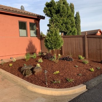 Tefra Maintenance - a front yard with a flower bed - Landscaping Near Me Tefra Maintenance - a front yard with a flower bed - Landscaping Near Me
