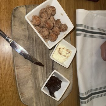 Hank's - Donut holes covered in cinnamon sugar with whipped cream and ganache - Coffee & Tea Near Me - Austin, Texas Hank's - Donut holes covered in cinnamon sugar with whipped cream and ganache - Coffee & Tea Near Me - Austin, Texas