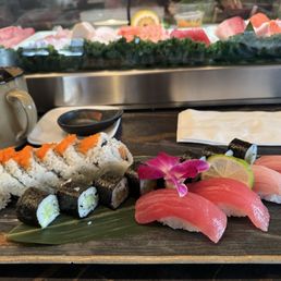 Maguro, yellowtail, cucumber roll and sunset roll.  $38 without tip.