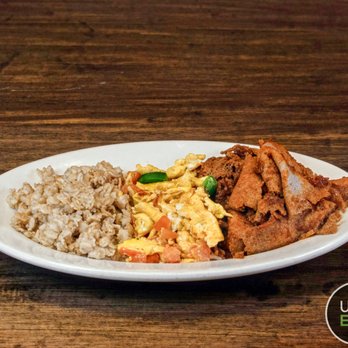Bethel Cafe - a plate of food on a wooden table - African Near Me - Arlington, Virginia Bethel Cafe - a plate of food on a wooden table - African Near Me - Arlington, Virginia