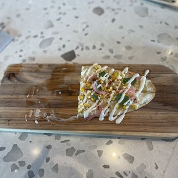 True Food Kitchen - I ate half of the elote flatbread before I remembered to take a photo! - New American Near Me - Tucson, Arizona