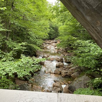 Kancamagus Highway - On covered bridge looking down the flume Gouge - Hiking Near Me - Conway, New Hampshire Kancamagus Highway - On covered bridge looking down the flume Gouge - Hiking Near Me - Conway, New Hampshire