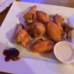 Paddy O'Flaherty's Pub & Eatery - I asked for bbq wings, this is what I received (spicy). I asked for a side of bbq and was barely given any. I'm not amused.
