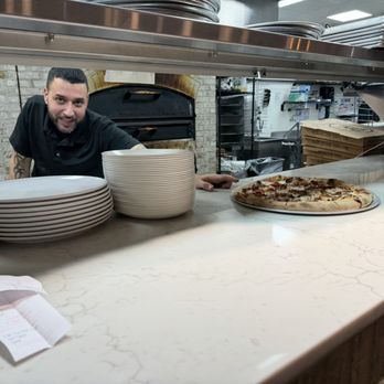 Flippers Pizza - He caught me admiring his pie. The chef takes pride in his work, and I don't blame him. - Pizza Near Me - Orlando, Florida Flippers Pizza - He caught me admiring his pie. The chef takes pride in his work, and I don't blame him. - Pizza Near Me - Orlando, Florida