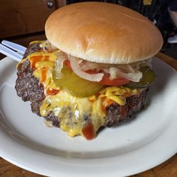 Illinois Bar & Grill On 47th - Famous cheeseburger with grilled onions.