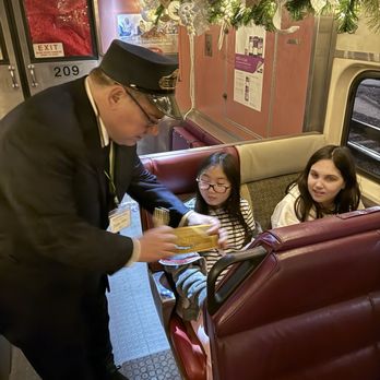 The Polar Express Train Ride - Conductor makes the Golden Pass official. - Local Flavor Near Me - Saint Louis, Missouri The Polar Express Train Ride - Conductor makes the Golden Pass official. - Local Flavor Near Me - Saint Louis, Missouri