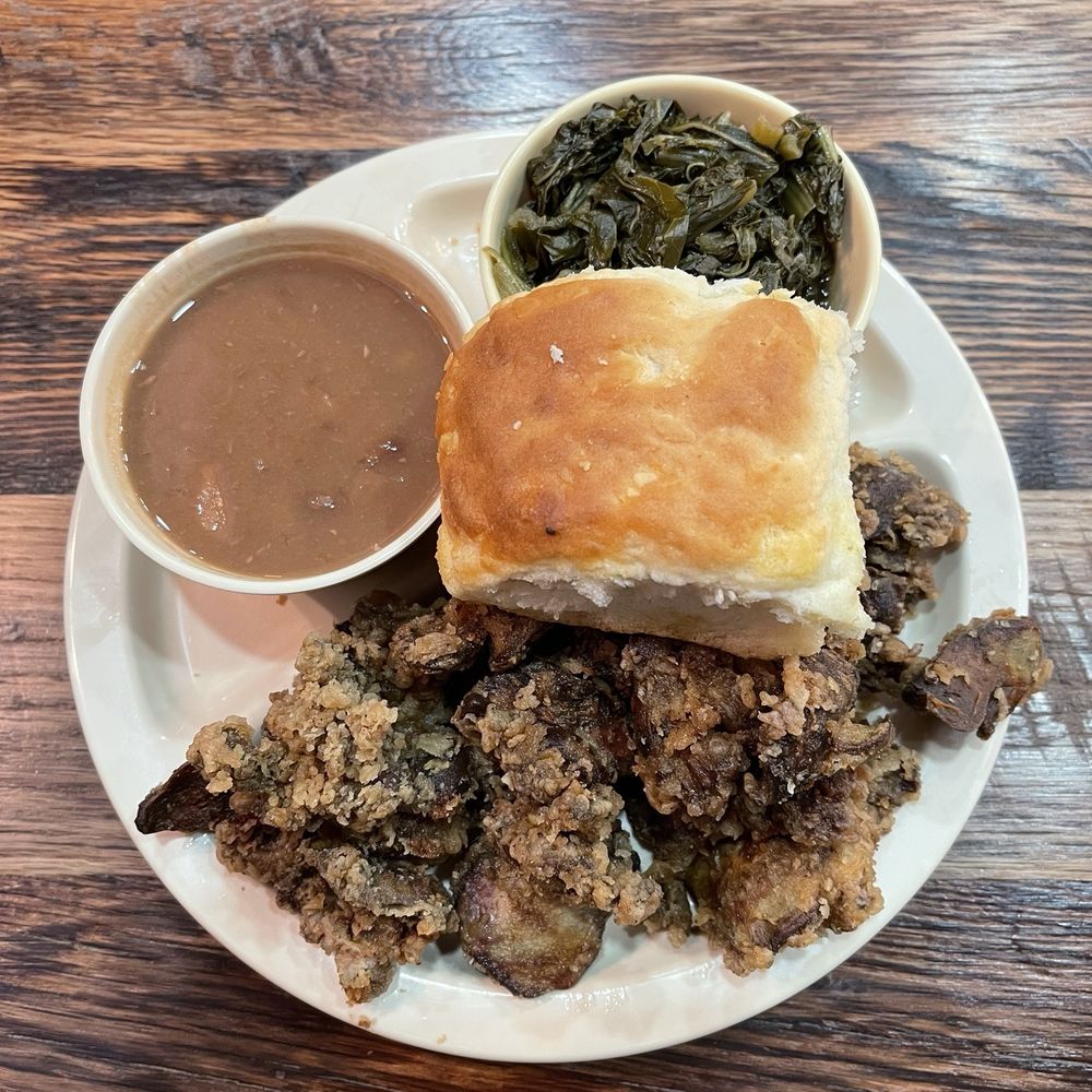 Fried chicken livers, collard greens, and pinto beans with a biscuit Fried chicken livers, collard greens, and pinto beans with a biscuit