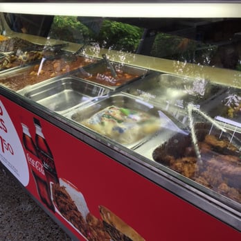Marlins Market - Preparing the hot food area for the day - Grocery Near Me - Miami Beach, Florida