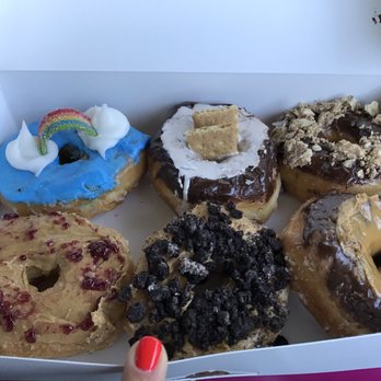 Amy's Donuts - Top left and then clockwise.. Over the Rainbow, S'mores, Nutty bars, Chocolate Cookie Butter, Peanut Butter Oreo, PB&J. - Donuts Near Me - Tucson, Arizona