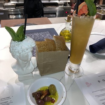 Doya - Complimentary bread and olives. Bread was good. Apollo and another rum cocktail. Cocktails were not good. - Turkish Near Me - Miami, Florida