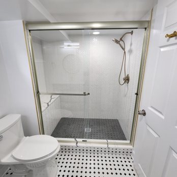 Garza Contractors - a bathroom with a toilet and shower - General Contractors Near Me - Silver Spring, Maryland Garza Contractors - a bathroom with a toilet and shower - General Contractors Near Me - Silver Spring, Maryland