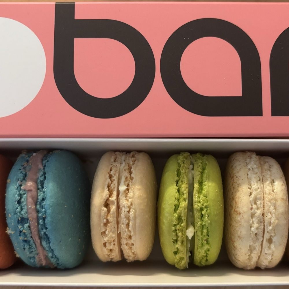 Macaron Bar - Short North - 6 Piece Macarons Box (bar) Left to right: Red Velvet, Blueberry cheesecake, Madagascar vanilla, Pistachio, Snickerdoodle, and Coffee - Bakeries Near Me - Columbus, Ohio Macaron Bar - Short North - 6 Piece Macarons Box (bar) Left to right: Red Velvet, Blueberry cheesecake, Madagascar vanilla, Pistachio, Snickerdoodle, and Coffee - Bakeries Near Me - Columbus, Ohio