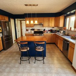 SBV Renovations - custom built 48" drawer bank island with butcher-block top, tiled backsplash, and accent painting on soffits, pantry wall and island