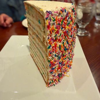 Palm Grill - 16-Layer Rainbow Cake - New American Near Me - Valley Stream, New York Palm Grill - 16-Layer Rainbow Cake - New American Near Me - Valley Stream, New York