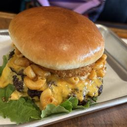 Burger with macaroni and cheese topping. Burger with macaroni and cheese topping.