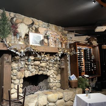 Ewings on the Kern - a stone fireplace in a restaurant - New American Near Me - Kernville, California