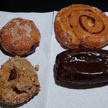 Bob's Donuts - Clockwise, from upper left: chocolate creme filled sigar donut, cinnamon roll, chocloate iced buttermilk bar, crumb donut. - Donuts Near Me - San Francisco, California Bob's Donuts - Clockwise, from upper left: chocolate creme filled sigar donut, cinnamon roll, chocloate iced buttermilk bar, crumb donut. - Donuts Near Me - San Francisco, California