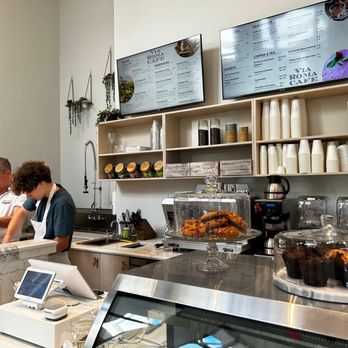 Via Roma Cafe - a man and a woman at the counter - Cafes Near Me - Palm Beach, Florida Via Roma Cafe - a man and a woman at the counter - Cafes Near Me - Palm Beach, Florida