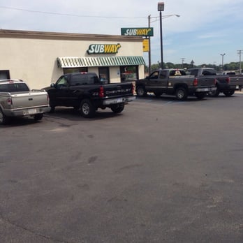 Subway - a row of trucks parked in a parking lot - Sandwiches Near Me - Caro, Michigan