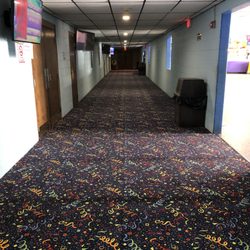 Showland Cinema - Our theatre hallway entrance to each theatre with colorful and newly installed carpet for that festive look.