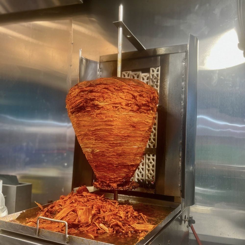 a large fryer with a lot of food in it a large fryer with a lot of food in it