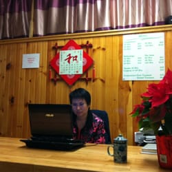 Natural Health - Owner Danlu checks appointments for today.