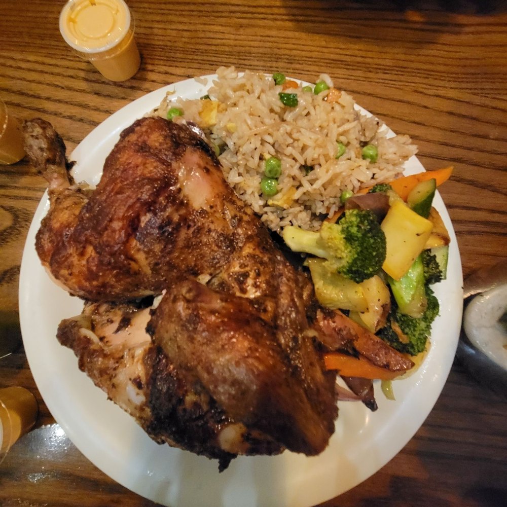 Quarter Pollo La Brasa with Chau fa (Peruvian ChInese Fried Rice ) with grilled vegetables. Quarter Pollo La Brasa with Chau fa (Peruvian ChInese Fried Rice ) with grilled vegetables.