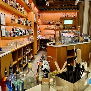 The Milkman's Bar - a counter with bottles and utensils - Cocktail Bars Near Me - Charlottesville, Virginia The Milkman's Bar - a counter with bottles and utensils - Cocktail Bars Near Me - Charlottesville, Virginia