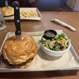Chicken sandwich and side salad. Chicken sandwich and side salad.