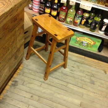 Cork N' Bottle -  wooden stool in a store - Beer, Wine & Spirits Near Me - Madison, Wisconsin