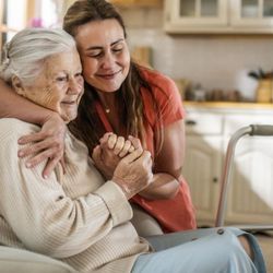 Cape Senior Home Healthcare - A caregiver embracing and comforting an elderly woman in her home, demonstrating Cape Senior Home Health Care's dedication to...