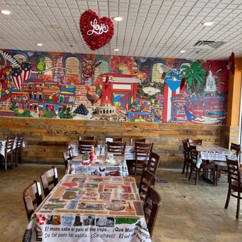 Isla Del Encanto - a restaurant with tables and chairs - Puerto Rican Near Me - Miami, Florida Isla Del Encanto - a restaurant with tables and chairs - Puerto Rican Near Me - Miami, Florida