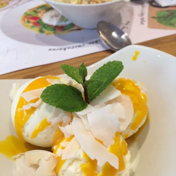 Wagamama - Coconut reika (3 scoops of ice cream & passion fruit coulis topped with flaked coconut) - Asian Fusion Near Me - Belfast, BFS