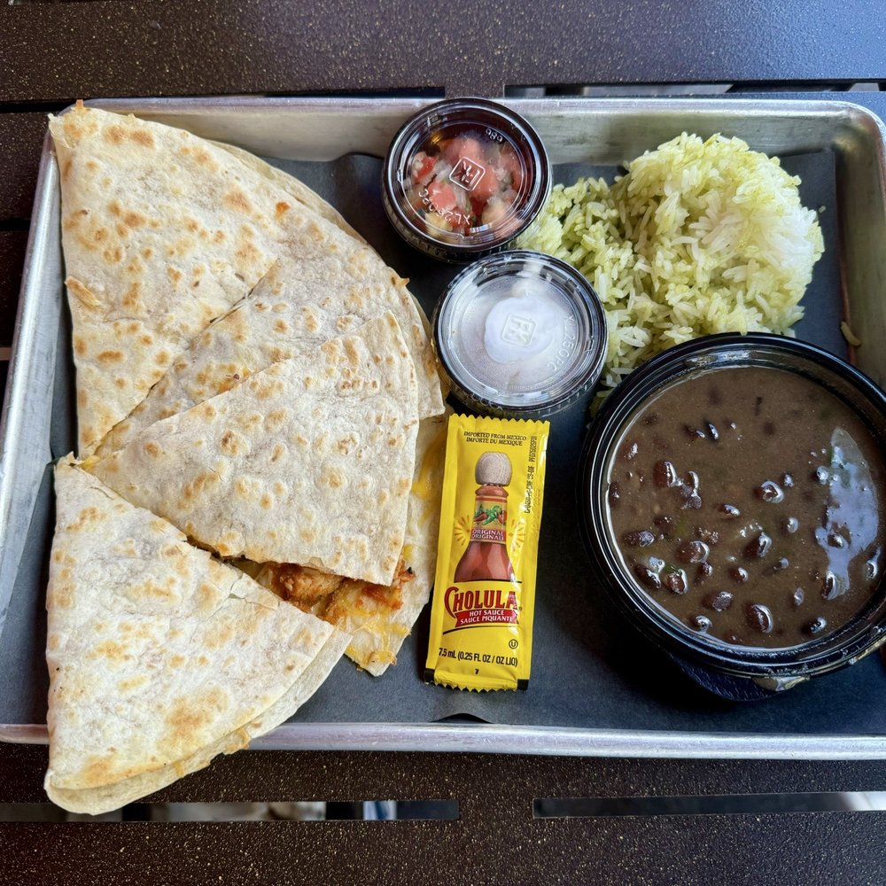 Escudo's Bar & Grill - "Fiesta Chicken Quesadilla" (flour tortilla filled with cheese, seasoned chicken breast, black bean & corn pico de gallo) - Cocktail Bars Near Me - Orlando, Florida Escudo's Bar & Grill - "Fiesta Chicken Quesadilla" (flour tortilla filled with cheese, seasoned chicken breast, black bean & corn pico de gallo) - Cocktail Bars Near Me - Orlando, Florida