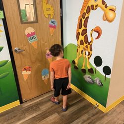 Great Beginnings Christian Preschool & Childcare - Murals all around the inside of the building; doors decorated for each season