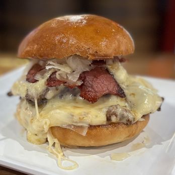 The Barn & Barrel - The Dublin Double... double patty smash burger with Provolone and Swiss, loaded with corned beef and sauerkraut! March feature burger! - Comfort Food Near Me - Canistota, South Dakota The Barn & Barrel - The Dublin Double... double patty smash burger with Provolone and Swiss, loaded with corned beef and sauerkraut! March feature burger! - Comfort Food Near Me - Canistota, South Dakota
